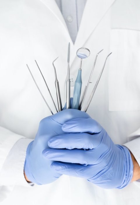 close-up-of-dentist-hands-with-dental-equipment.jpg